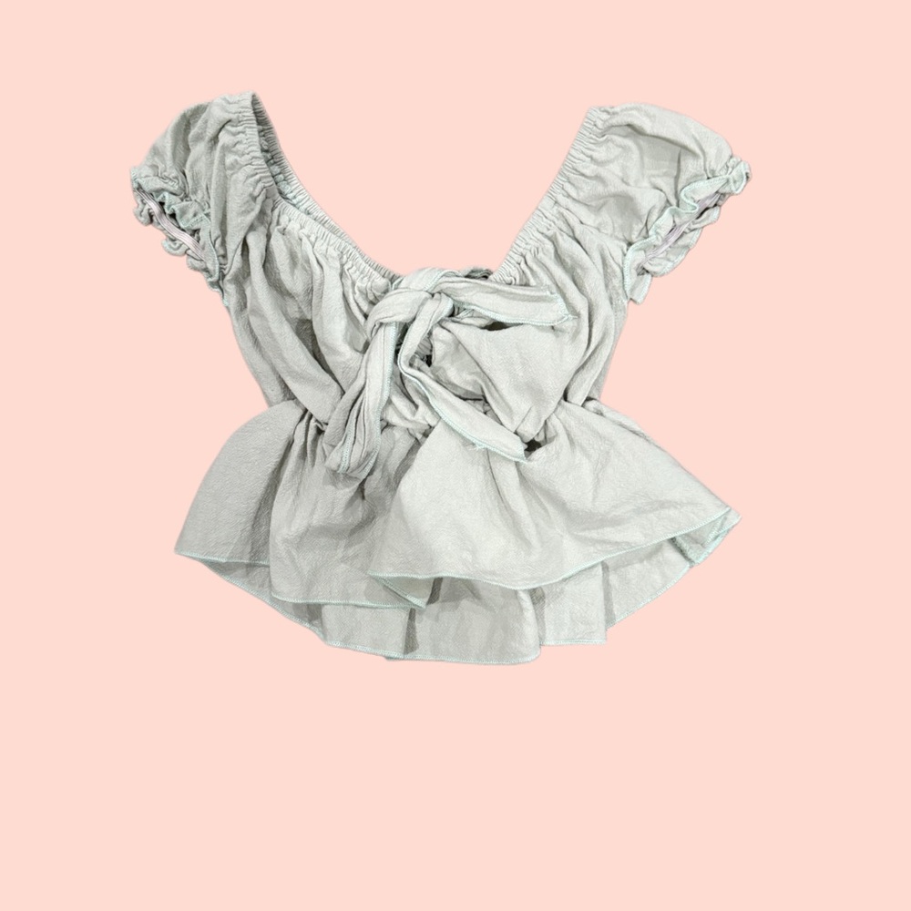 Cream and white ruffle top with tie front detail